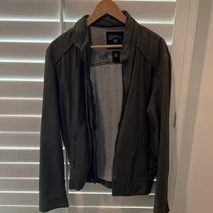 Converse Black Canvas army green casual jacket with foldaway hood.